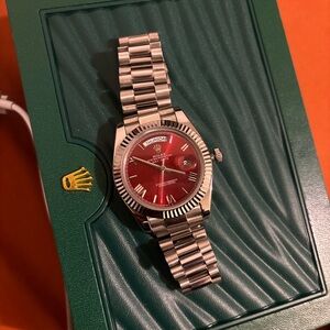 Rolex Silver Bracelet Watch with Red Dial